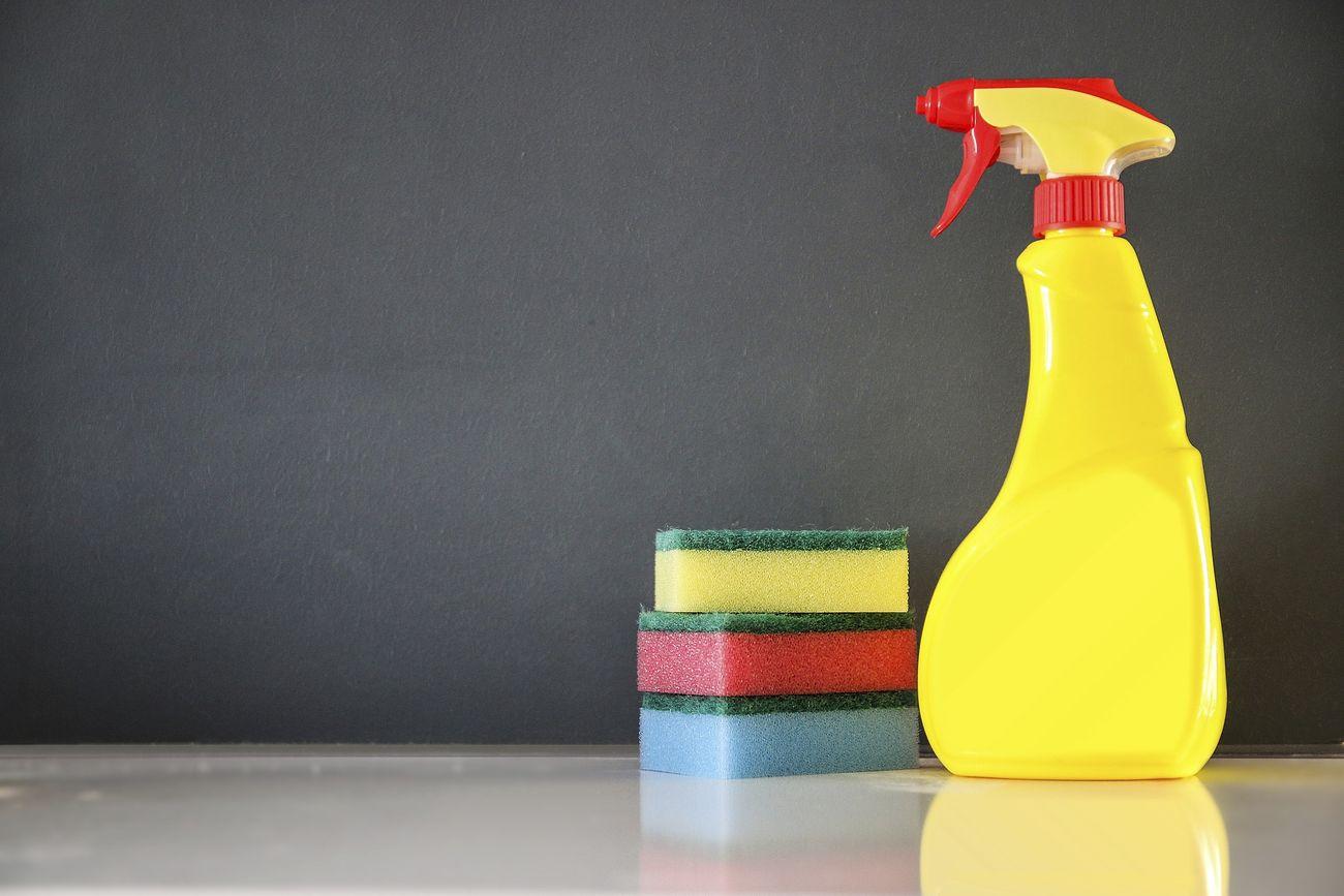 a yellow plastic bottle of deter deter deterant - Cleaning products